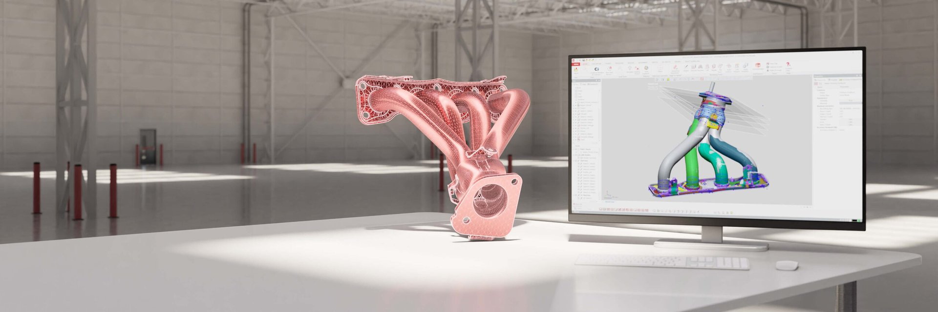 Scanned exhaust manifold beside a monitor running Geomagic Design X
