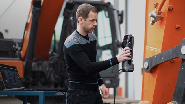 Technician using a Go!SCAN 3D scanner on industrial equipment