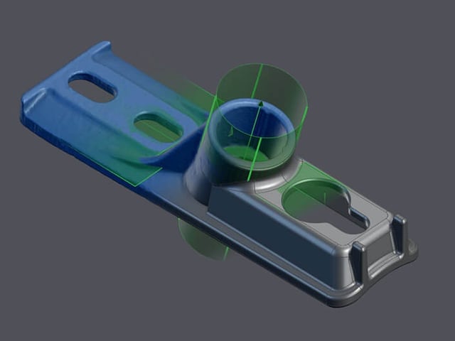 CAD surfaces rebuilt over the 3D scan of a machined part