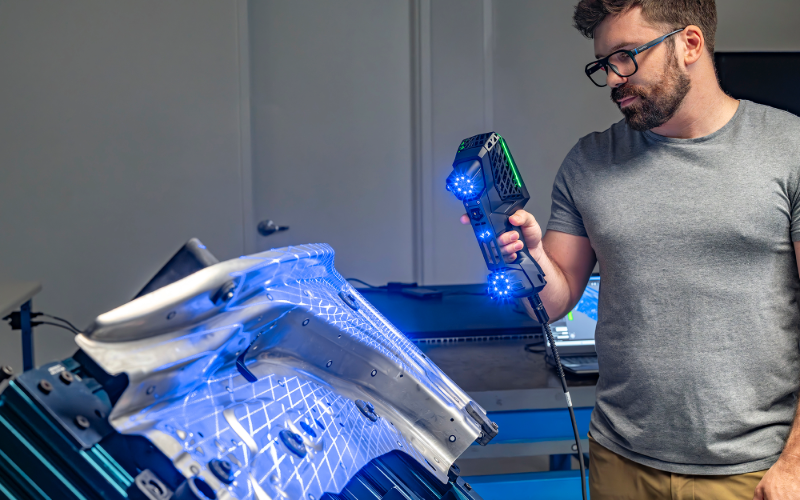 Technician scanning with the HandySCAN 3D EVO in a workshop