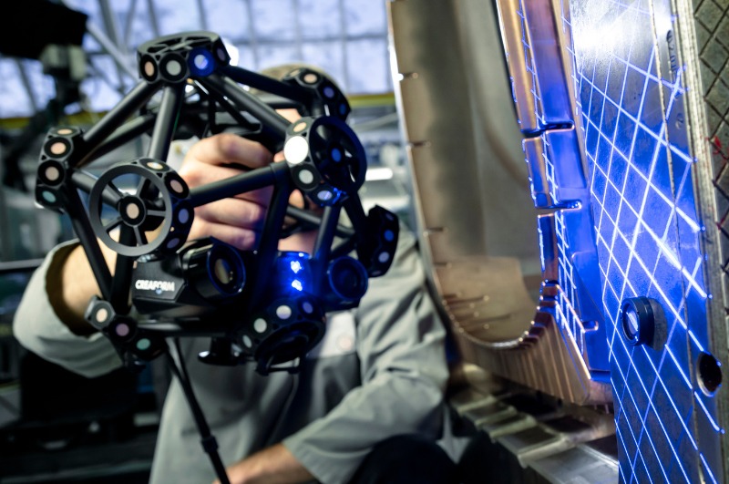 MetraSCAN 3D optical CMM scanner measuring a production part