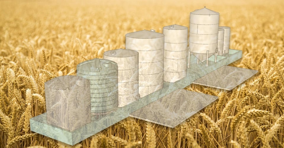 Photo illustration of KeyCreator models of agricultural loading bins over a wheat field