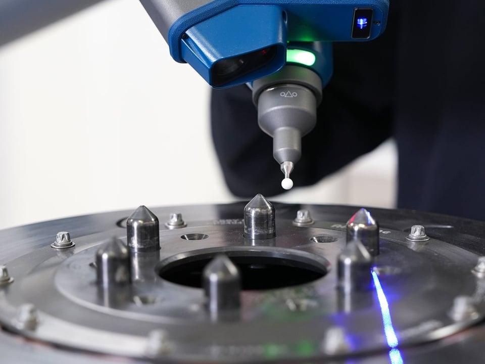 Contact probe and FAROBlu laser line on a FARO Quantum X Arm measuring a brake rotor